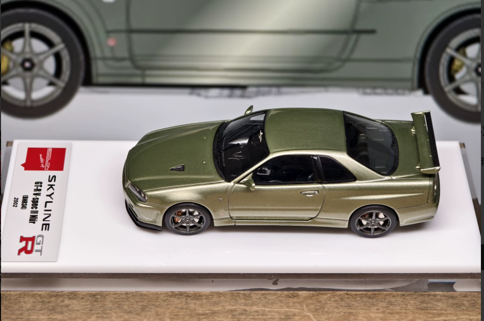 Make Up 1/43 Nissan Skyline GT-R R34 V-spec II Nur Millennium Jade EM372A
