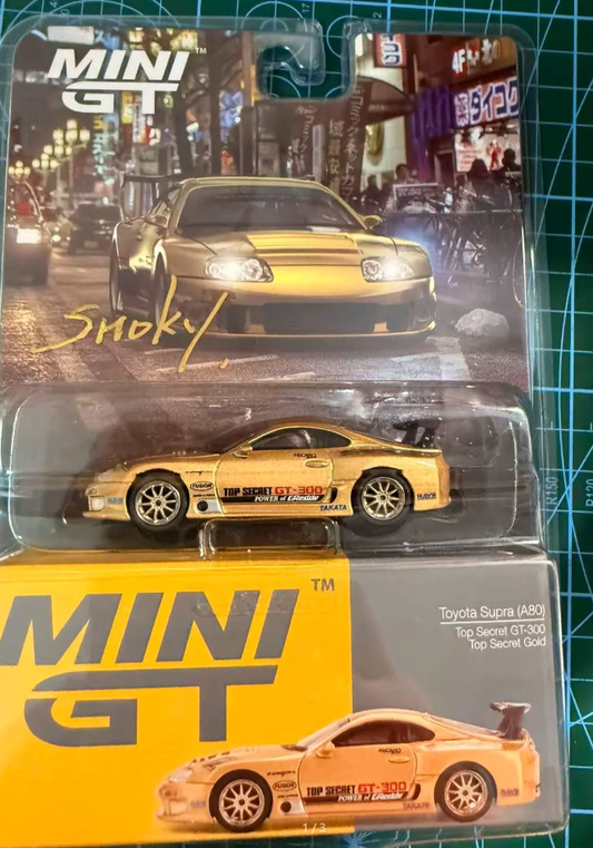 MINI GT 961 Toyota Supra A80 Top Secret GT300 Gold Smokey Nagata Signed 1:64