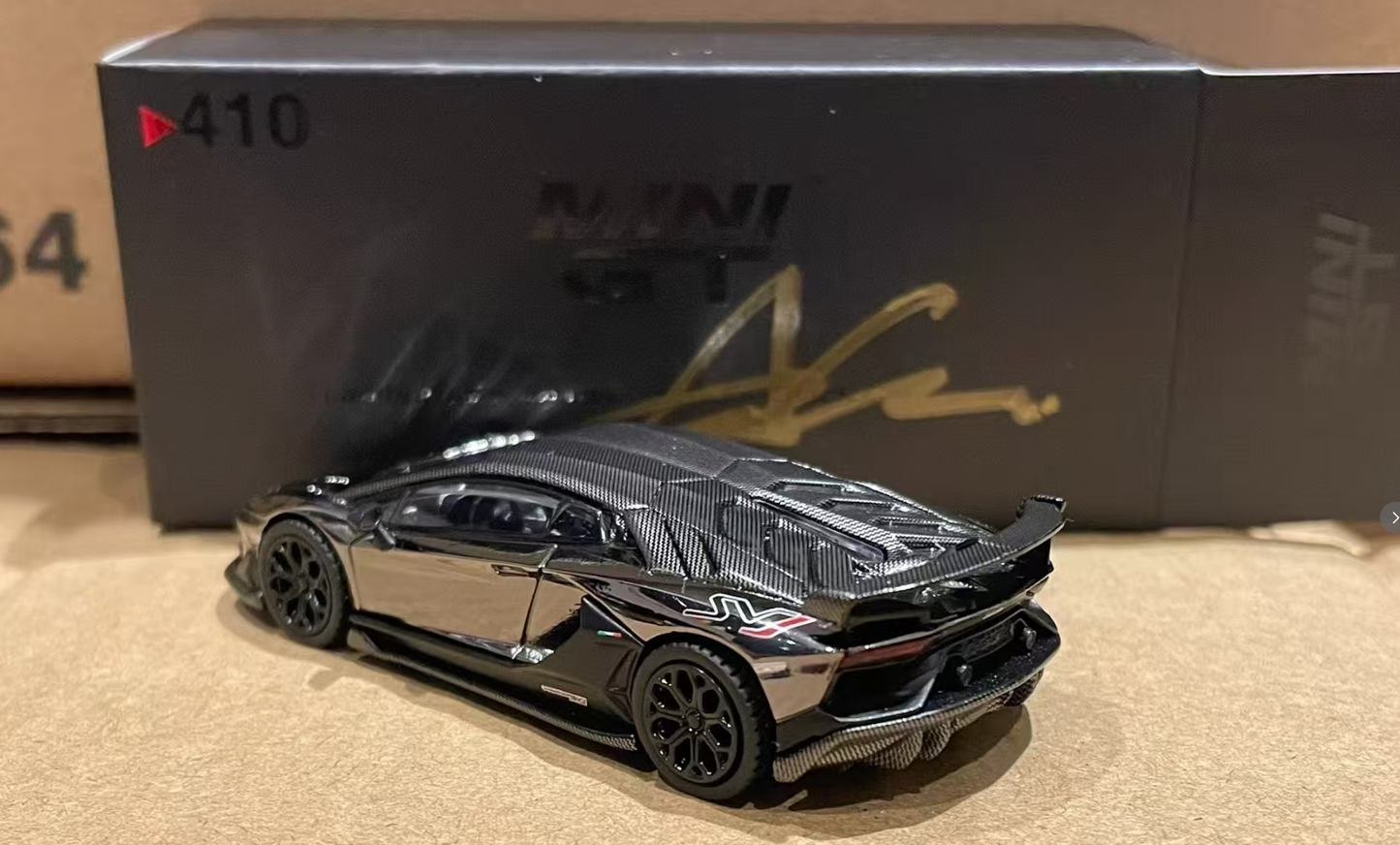 MINI GT 1/64 No.410 Lamborghini Aventador SVJ Black Chrome Director's Gift