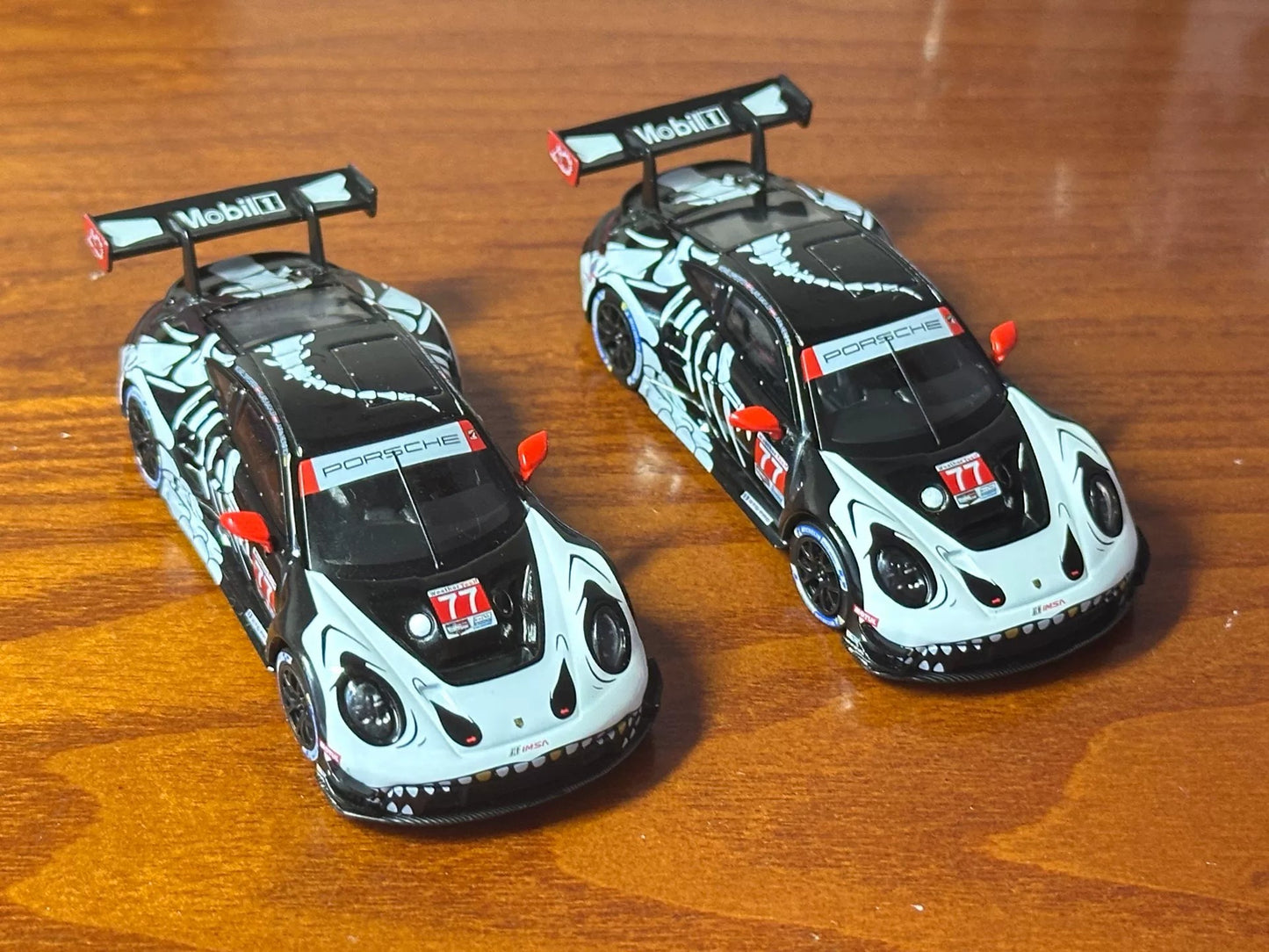 MINI GT 1/64 Porsche 911 GT3 R #77 AO Racing Skeleton Rexy