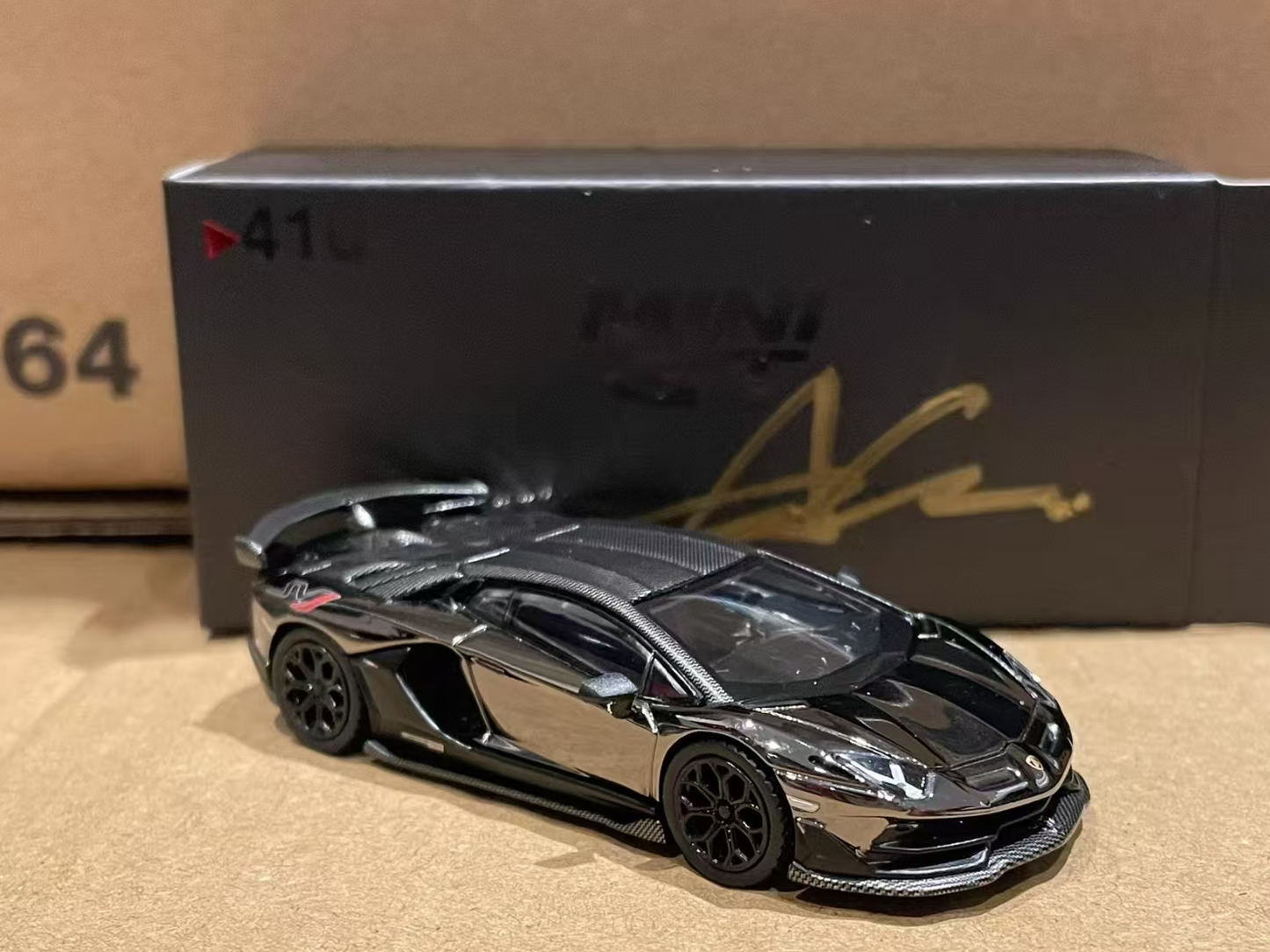 MINI GT 1/64 No.410 Lamborghini Aventador SVJ Black Chrome Director's Gift