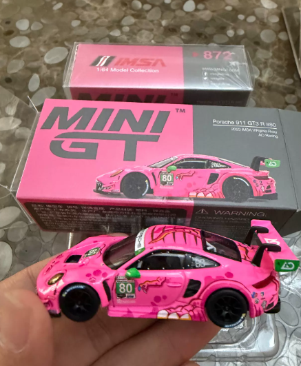 MINI GT 872 Porsche 911 GT3 R AO Racing Pink Dino IMSA 2023